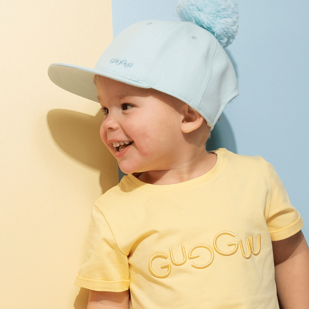 Laadukas Gugguun Tuft Cap White Glow
